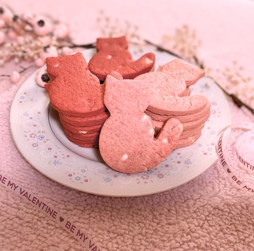 a strawberry cat shaped cookie. 